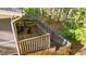 A wooden deck with stairs leading to the backyard, surrounded by a wooden fence at 541 Oak Run Dr, Raleigh, NC 27606