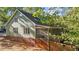 An exterior shot of a home featuring a screened porch and brick foundation at 541 Oak Run Dr, Raleigh, NC 27606