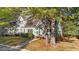Charming home exterior with well-manicured lawn and mature trees in a residential neighborhood at 541 Oak Run Dr, Raleigh, NC 27606