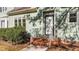 A front entrance with brick steps, white railings, and a well-maintained lawn at 541 Oak Run Dr, Raleigh, NC 27606