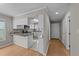 Well-lit kitchen with white cabinets, granite countertops, and stainless steel appliances at 541 Oak Run Dr, Raleigh, NC 27606