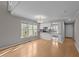 Open living space with kitchen view, featuring hardwood floors and great natural light at 541 Oak Run Dr, Raleigh, NC 27606
