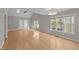 Bright living room featuring hardwood floors, a ceiling fan, and views to the outside at 541 Oak Run Dr, Raleigh, NC 27606