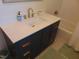 Well-lit bathroom with modern vanity, gold hardware, and subway tile in the shower at 5531 Autry Rd, Rocky Mount, NC 27803