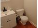 A close-up of a quaint bathroom featuring a modern sink and a standard toilet at 5531 Autry Rd, Rocky Mount, NC 27803