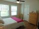 Bedroom featuring hardwood floors, neutral walls, and windows with blinds at 5531 Autry Rd, Rocky Mount, NC 27803
