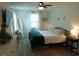A modern bedroom features natural light, wood flooring, and bright decor at 5531 Autry Rd, Rocky Mount, NC 27803
