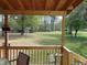 Exterior view of back porch with a wooded backyard at 5531 Autry Rd, Rocky Mount, NC 27803