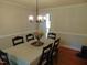 Traditional dining room featuring a chandelier and seating for six guests at 5531 Autry Rd, Rocky Mount, NC 27803