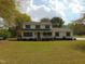 Charming two-story home with manicured lawn and traditional curb appeal in a peaceful, tree-lined neighborhood at 5531 Autry Rd, Rocky Mount, NC 27803