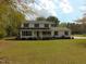 Well-maintained two-story house with landscaped front yard and symmetrical design at 5531 Autry Rd, Rocky Mount, NC 27803