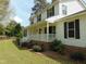 Two-story home with a charming, covered front porch and well-maintained landscaping at 5531 Autry Rd, Rocky Mount, NC 27803