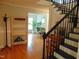 Inviting view of the foyer, with hardwood floors, staircase, and ample natural light at 5531 Autry Rd, Rocky Mount, NC 27803