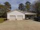 Spacious detached garage with multiple bays and carport for vehicle storage at 5531 Autry Rd, Rocky Mount, NC 27803