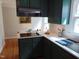 Modern kitchen featuring painted cabinets and stainless steel appliances and eat-in dining area at 5531 Autry Rd, Rocky Mount, NC 27803
