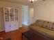 Bright and spacious living area featuring hardwood floors, a white cabinet, and neutral paint at 5531 Autry Rd, Rocky Mount, NC 27803
