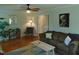 Well-lit living room with ample seating, modern decor, and hardwood floors at 5531 Autry Rd, Rocky Mount, NC 27803
