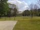 Fenced backyard view with shed in distance at 5531 Autry Rd, Rocky Mount, NC 27803