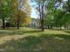 Expansive front yard view of home nestled amongst the trees at 5531 Autry Rd, Rocky Mount, NC 27803