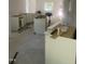 Spacious kitchen being installed with white cabinets, large window offering natural light at 5875 Green Pine Rd, Cedar Grove, NC 27231