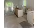 Kitchen with cabinets being installed, large windows offering natural light and scenic views at 5875 Green Pine Rd, Cedar Grove, NC 27231