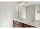 Bathroom featuring double sinks, a large mirror, and wood cabinets at 624 S Kennelman Cir, Wendell, NC 27591