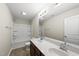 A bright bathroom features double sinks, white cabinets, and a shower-tub combination at 624 S Kennelman Cir, Wendell, NC 27591