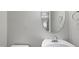 Clean bathroom with a white sink, round mirror, and chrome fixtures at 624 S Kennelman Cir, Wendell, NC 27591