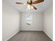 A cozy bedroom featuring neutral walls, carpet, a window and a ceiling fan at 624 S Kennelman Cir, Wendell, NC 27591