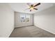 Bedroom featuring carpeted floors, and two bright windows providing natural light at 624 S Kennelman Cir, Wendell, NC 27591