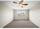 Empty bedroom featuring carpeted floors, and a bright window providing natural light at 624 S Kennelman Cir, Wendell, NC 27591