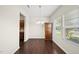 Bright dining room with hardwood floors, chandelier, and natural light from the window at 624 S Kennelman Cir, Wendell, NC 27591