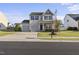 Charming two-story home featuring a well-manicured lawn and a two-car attached garage at 624 S Kennelman Cir, Wendell, NC 27591
