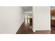 Inviting hallway with hardwood floors, leading to an open kitchen and living area at 624 S Kennelman Cir, Wendell, NC 27591