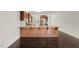 Spacious kitchen with granite countertops, stainless steel appliances, and dark hardwood floors at 624 S Kennelman Cir, Wendell, NC 27591