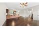 Open concept living space with kitchen, bathroom, stairs, and hardwood floors at 624 S Kennelman Cir, Wendell, NC 27591