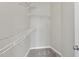 Spacious walk-in closet featuring carpeted floors, white trim and wire shelving for ample storage at 624 S Kennelman Cir, Wendell, NC 27591