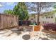 Beautiful backyard with a well-maintained patio area, wooden fence, and mature landscaping at 8721 Owl Roost Pl, Raleigh, NC 27617