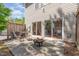 Private patio featuring a fire pit, outdoor seating, and access to the home's interior at 8721 Owl Roost Pl, Raleigh, NC 27617
