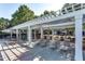 Community pool area with lounge chairs, shade structures, and well-maintained landscaping at 8721 Owl Roost Pl, Raleigh, NC 27617