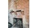 A brick fireplace is shown with brick corbels and a shelf support at 919 E Main St, Haw River, NC 27258