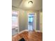 Hallway featuring an entrance to a bathroom with classic black and white checkerboard tile at 919 E Main St, Haw River, NC 27258