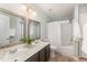 Primary bathroom featuring a double vanity and a shower and bathtub combo at 9904 Erinsbrook Dr, Raleigh, NC 27617