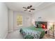 Bright, naturally lit bedroom features a ceiling fan and fun decor at 9904 Erinsbrook Dr, Raleigh, NC 27617