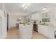 Charming eat-in kitchen with white cabinetry, stainless steel appliances, and granite countertops at 9904 Erinsbrook Dr, Raleigh, NC 27617