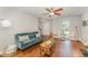 Cozy living room features a comfortable sofa, fireplace, and hardwood floors at 9904 Erinsbrook Dr, Raleigh, NC 27617