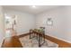 Home office with a work desk, stylish rug, and ample natural light at 9904 Erinsbrook Dr, Raleigh, NC 27617