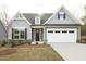 Charming home with a two-car garage and beautifully landscaped front yard with an 'Available' sign in the window at 0 Hwy 86, Cedar Grove, NC 27231