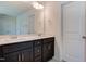 Bathroom featuring double sink vanity, chrome fixtures, framed mirrors, and natural light at 0 Sawmill, Cedar Grove, NC 27231