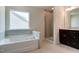 Elegant bathroom with a soaking tub under a window, a separate shower, and double vanity at 0 Sawmill, Cedar Grove, NC 27231